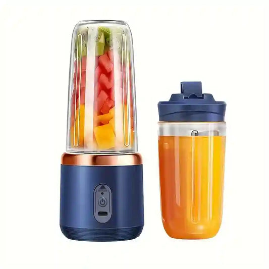 Portable blender with a container of fruit and a filled juice cup on a white background