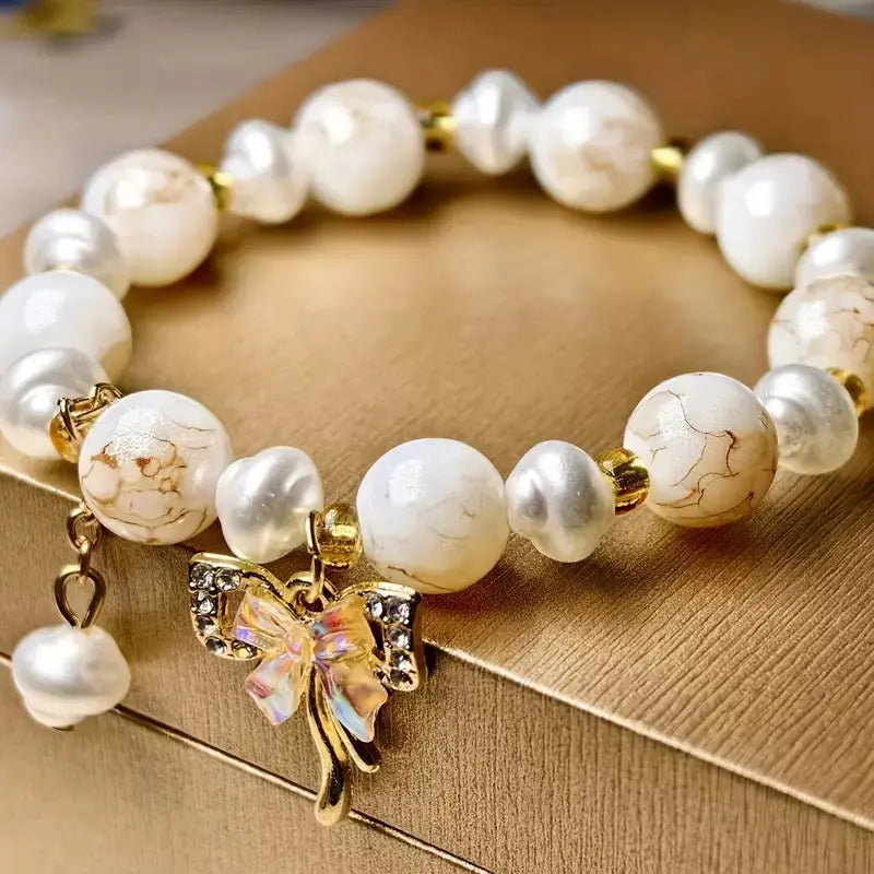 elegant-pearl-bracelet-with-butterfly-charm-pink-white